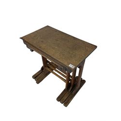 Arts & Crafts period oak nest of tables, rectangular tops on shaped upright supports, sledge feet, with visible tenon joints, 