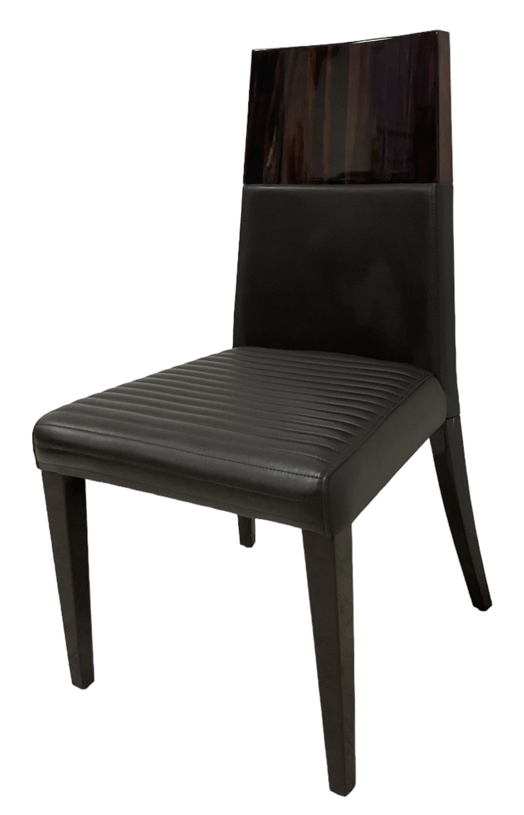 Giorgio Collection - Art Deco design macassar ebony 'Luna' extending dining table, oval top with quarter-matched veneer and stringing, raised on a curved V-shaped pedestal with oval base; with matching set of dining chairs, high macassar ebony back, the lower half and seat upholstered in black leather, on ebonised tapering supports, retailed by Harrods