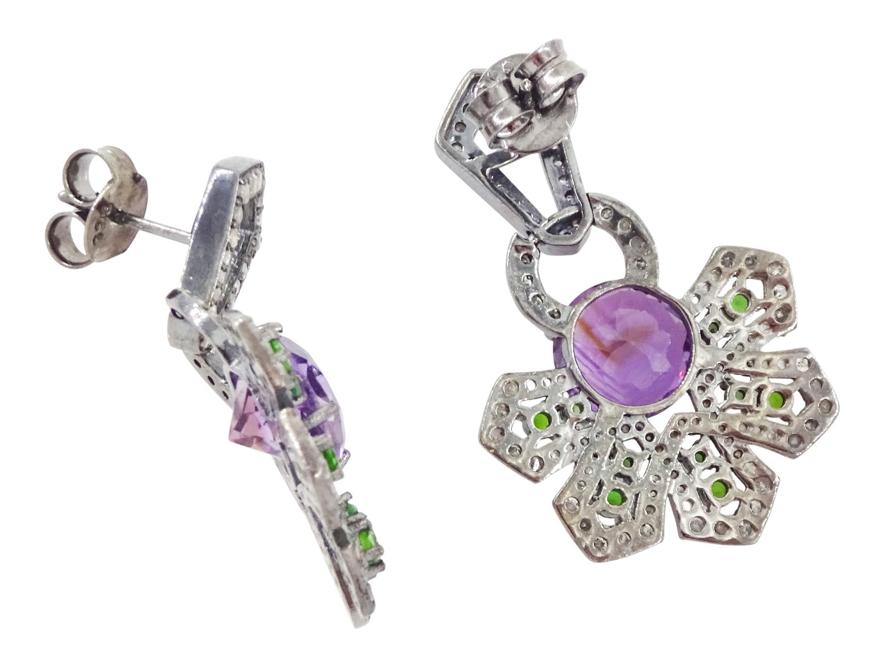 Pair of silver black rhodium plated amethyst, chrome diopside and diamond geometric earrings, each stud with a round brilliant cut amethyst, surrounded by diopsides and diamonds, suspending from a diamond set bail, total amethyst weight approx 5.00 carat, total diopside weight approx 1.00 carat, total diamond weight approx 1.85 carat