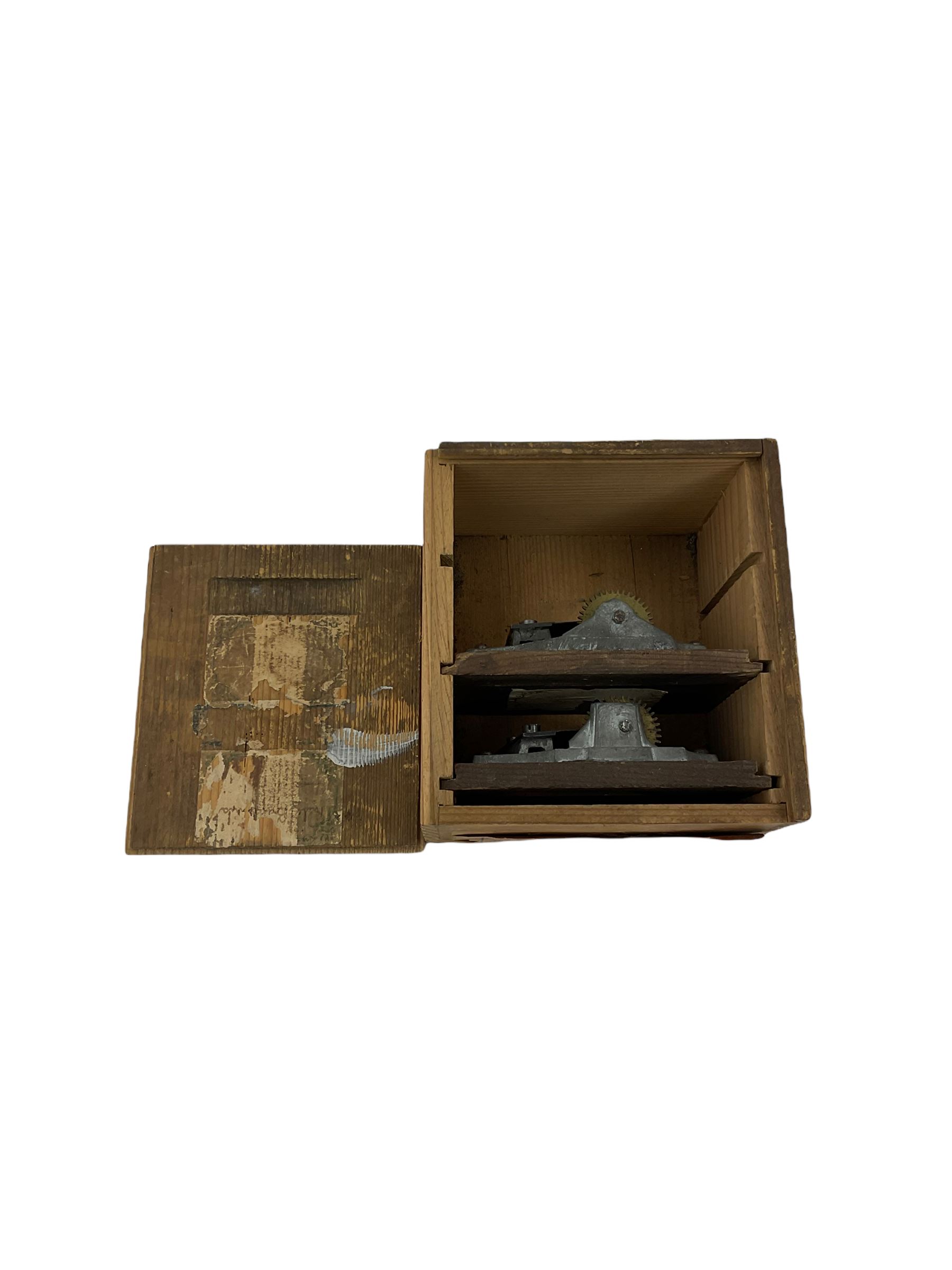 A German musical alarm clock (model 1523/24) made by the Hamburg Amerikanische Uhrenfabrik c1880, in an oak case with an architectural top and finial, two-part dial with a gilt centre, ivorine chapter and steel spade hands, with roman numerals and minute track, case raised on four bun feet, with a thirty-hour balance wheel pin pallet spring driven movement sounding the alarm on a musical movement, key wound and set from the rear. Compete with three different and changeable musical movements in their original box. These clocks would have been sold as here with separate musical movements, it is rare to find them with the original clock.
H30 W17 D11 

	



