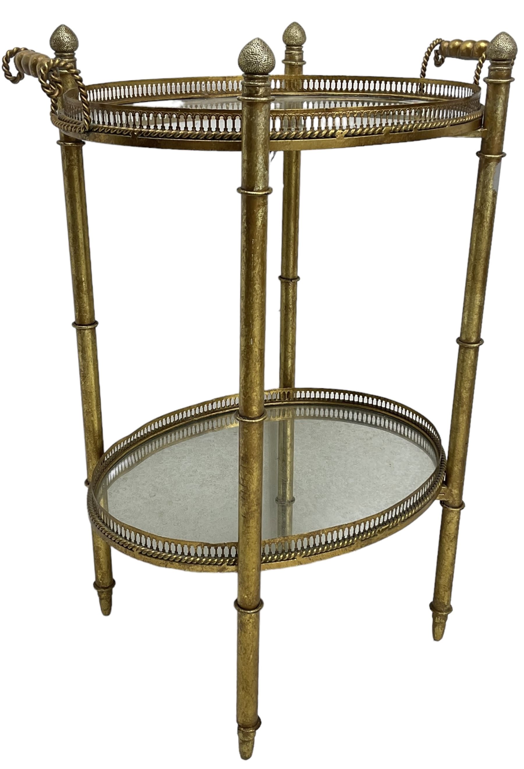 Gilt metal oval stand, two mirrored tray tiers with raised pierced galleries