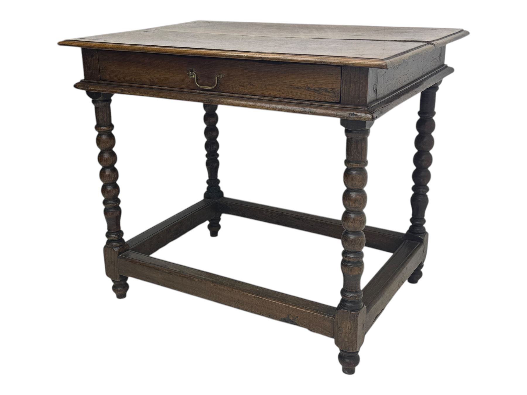 Late Victorian oak side table, rectangular top with moulded edge and frieze drawer with brass handle, raised on turned bulbous supports united by square-section stretchers