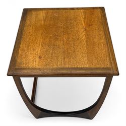 G-Plan - 'Astro' mid-century nest of three teak occasional tables, each with a square top with outer banding, on U-shaped end supports united by a stretcher