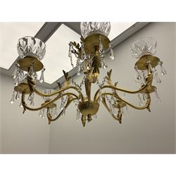 Gilt metal and glass mounted eight branch acanthus chandelier, the shaped stem with eight scrolling branches with glass drip tray bowls and leaf decoration joined with glass beaded chains and glass drops, 
