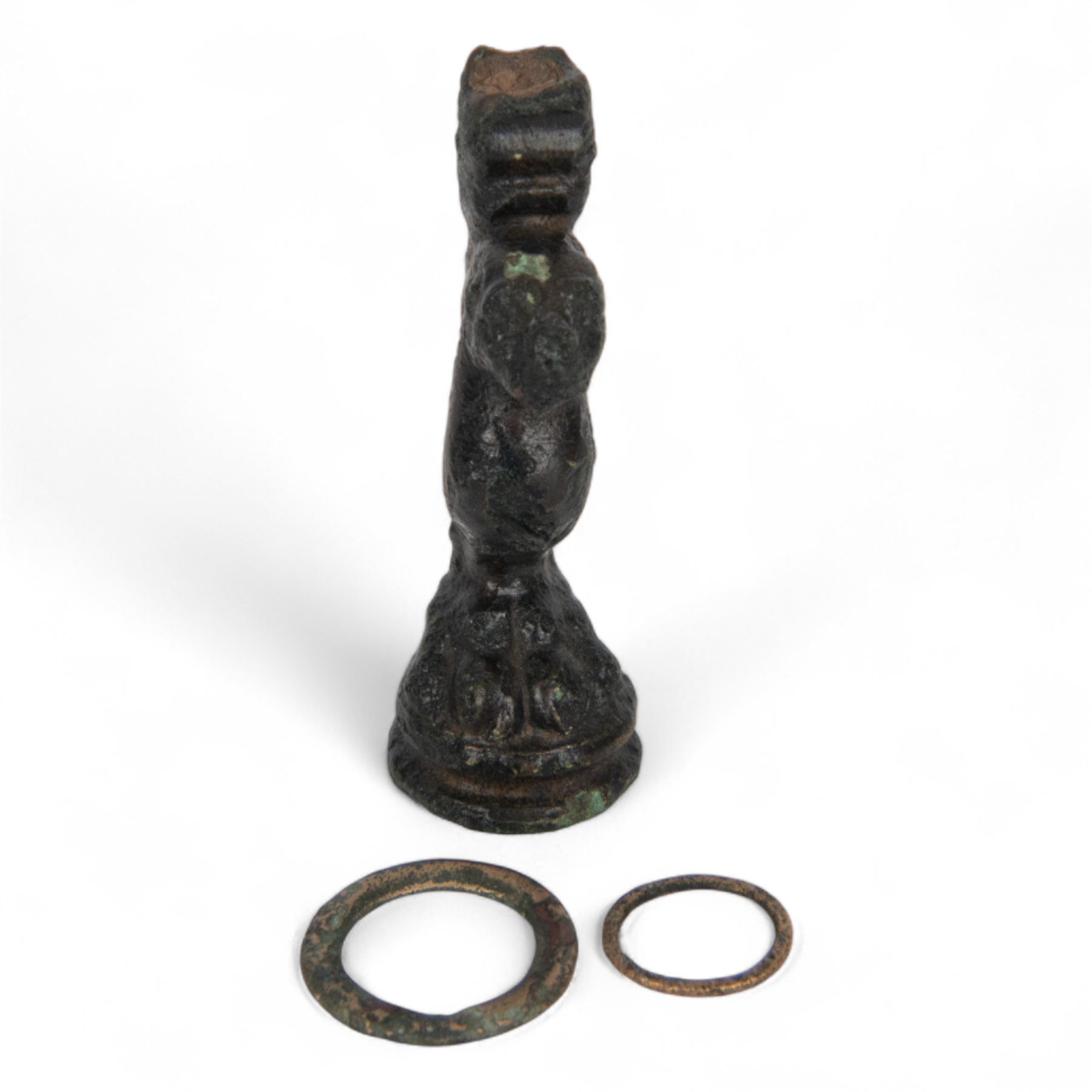 Roman casket leg, together with bronze rings from a horse harness 