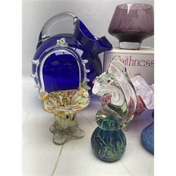 Mid-century cobalt blue glass pitcher of tilted spherical form with clear handle, together with three cups, the bowls of spherical form raised upon tapering feet, and further glass ware to include Mdina seahorse paperweight, boxed Swarovski butterfly figure, two Caithness vases, and art glass, pitcher H24cm