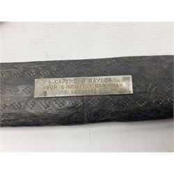 Omani presentation sword kattara, with 77cm  broad slightly curved single edge blade with two fullers, leather bound hilt woven with silver wire decoration and iron pommel;  in tooled leather scabbard with chased silver mounts and presentation plaque 'To Capt. D.M. Naylor From C Company NFR Oman Dec 1962' (Northern Frontier Regiment) L99cm overall