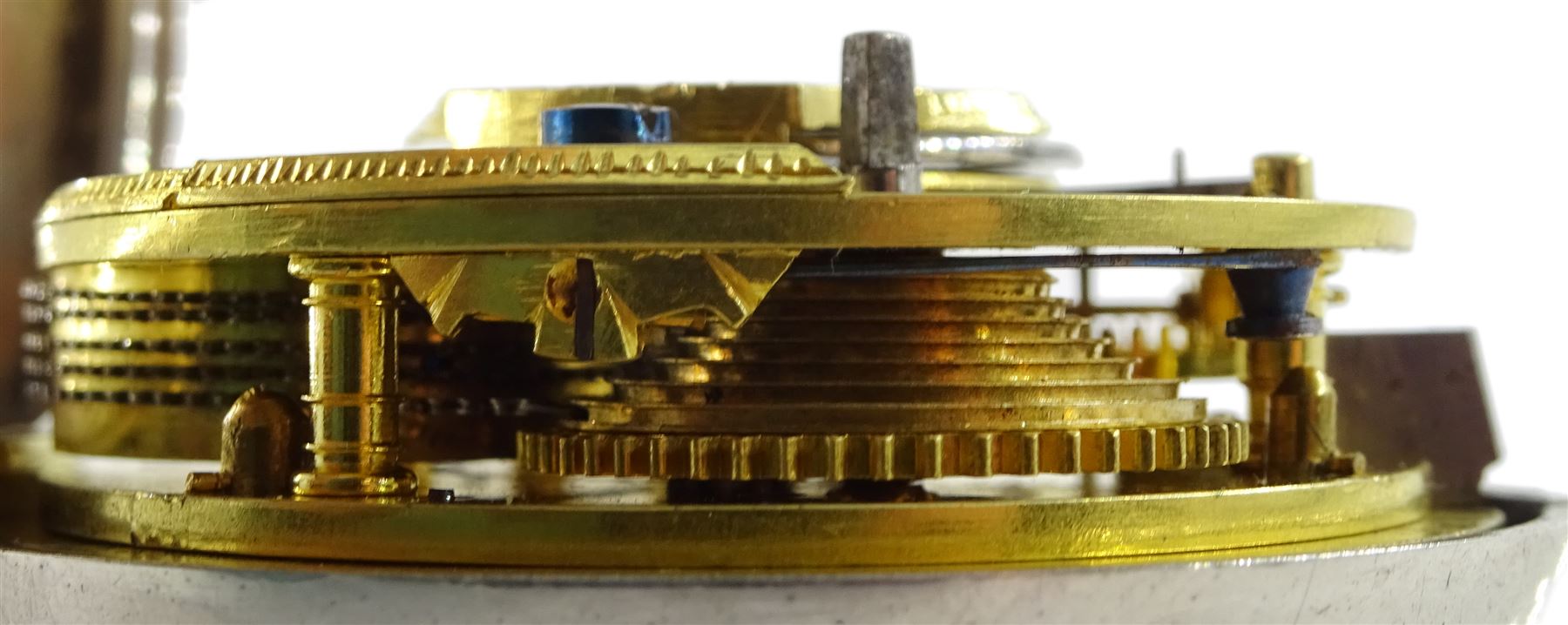 Victorian silver pair cased verge fusee pocket watch by J W Adcock, East Dereham, No. 98132, round pillars,  pierced and engraved balance cock decorated with a mask, enamel polychrome dial depicting a ploughing scene, Roman and Arabic numerals, case by Henry William Griffin, London 1864