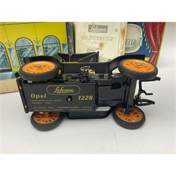 Schuco - four boxed Old Timer series tin-plate model cars comprising two 1228 Opel Doktor-Wagen 1909, one in yellow and another in blue, 1229 Mercedes Simplex anno 1902, and 1230 Renault 6CV/1911 Voiturette 