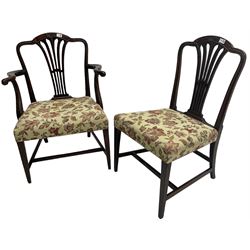 George III Hepplewhite design mahogany elbow chair and matching side chair, cresting rail carved with bellflowers over pierced and flared splat, seats upholstered in floral patterned fabric, raised on square tapering supports united by stretchers