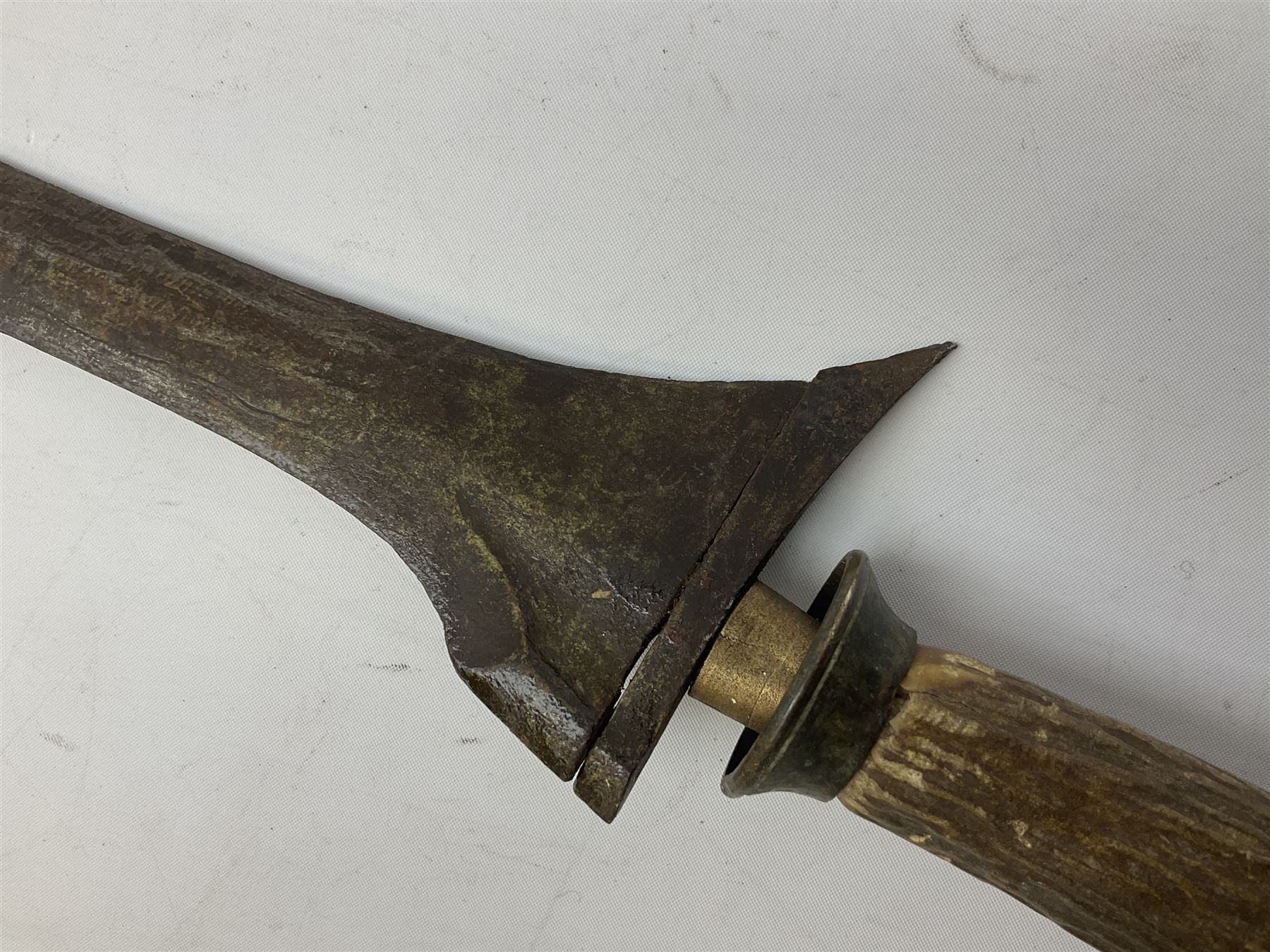 Malayan Kris dagger, the 31.5cm double edged straight heavy damascus blade with copper ferrule; carved hardwood grip; in large wooden throated scabbard with floral decorated white metal covering L47.5cm overall; a kris blade with adapted antler grip; and five various small daggers/letter openers (7)