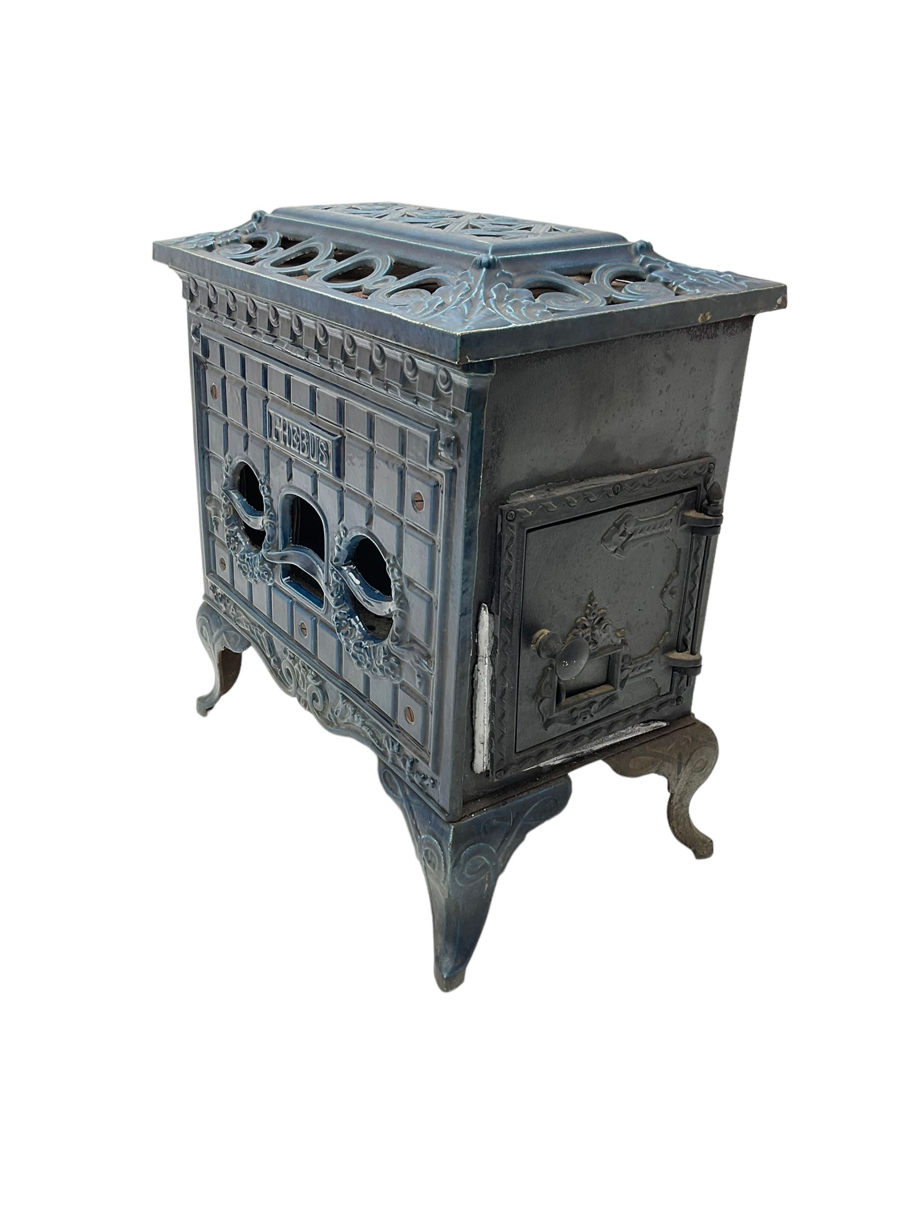 Poeles Nanquette - Art Deco 'Phebus' French enamel wood burning stove, indigo colour with pierced scrollwork decoration and acanthus leaves, on cabriole supports