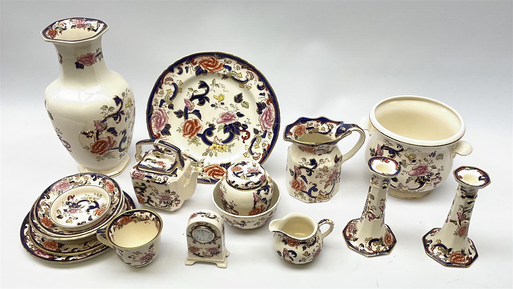 A group of Masons Ironstone Mandalay pattern wares, comprising large vase, planter with twin lug handles, three graduated plates, bowl, teapot, teacup and saucer, jug, smaller jug, open sucrier, small pot and cover, pair of candlesticks, small mantel clock, and pin dish. 