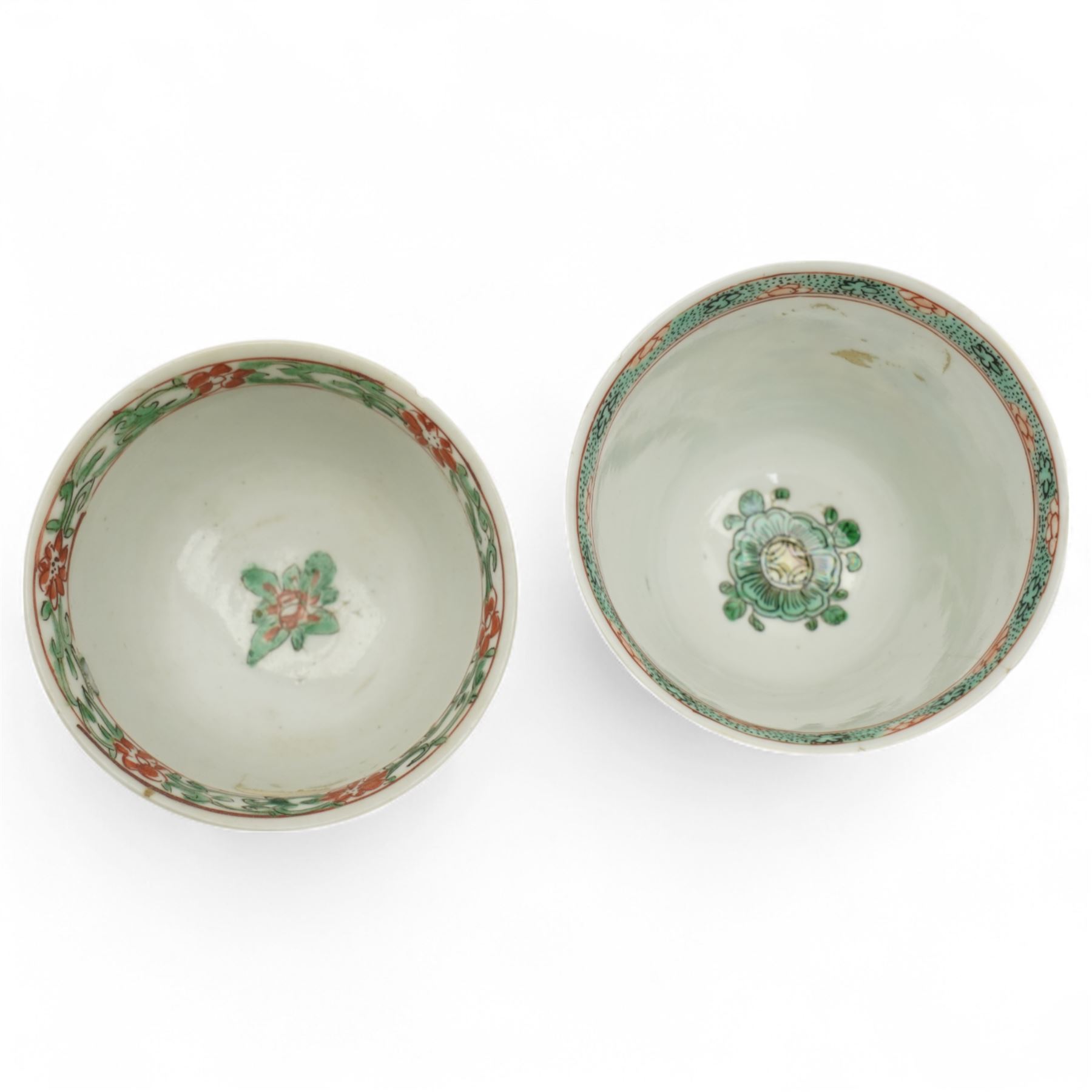 Three Chinese famille verte examples, approximately Yongzheng period, to include two teabowls and two saucers, each decorated with flowers and butterflies, two with sacred fungus mark within double rings, the teabowl with lotus mark, the other indistinct - possibly a Wan mark within lozenge (4)