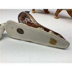 Group of Beswick figures to include leopard no 1082, rabbits, swan, pheasant no 1226 etc, all with marks beneath