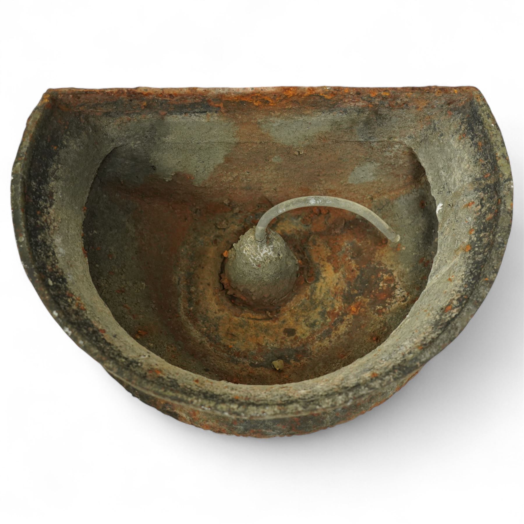 Victorian cast iron ‘lavabo’ lion's head wall fountain, the arched and crested backplate centred with a lion's head spout, with flanking scroll columns and gadrooned basin with flared rim

