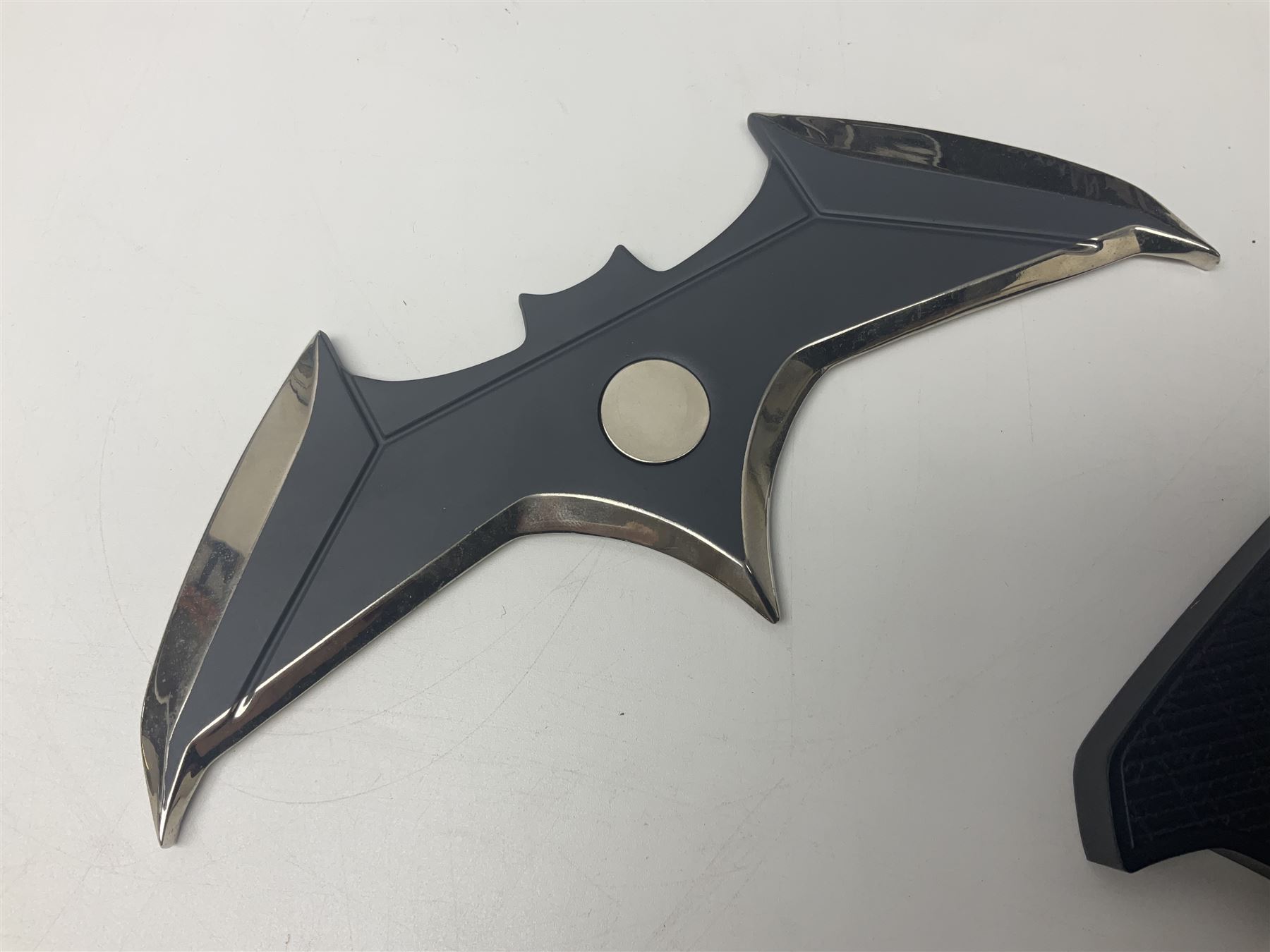 Two Batman replica Batarangs comprising DC Comics QMX Caliber Metalworks 1:1 scale replica with original box, and DC Direct The Dark Knight prop replica no. 33/1500 with original box and certificate of authenticity 