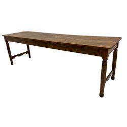 20th century oak dining table, narrow boarded top on turned supports joined by single shaped stretchers 