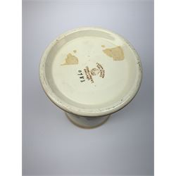 A Crown Devon Fieldings vase, of cylindrical form painted with a highland cattle scene and signed Cox, with printed marks beneath, H11.5cm