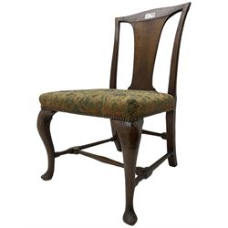 Mid-18th century mahogany side chair, shaped cresting rail over tapered back splat, seat upholstered in green and camel foliate patterned fabric with stud work border, raised on cabriole supports united by swell-turned stretchers