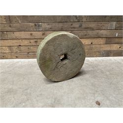 19th century circular stone mill wheel,