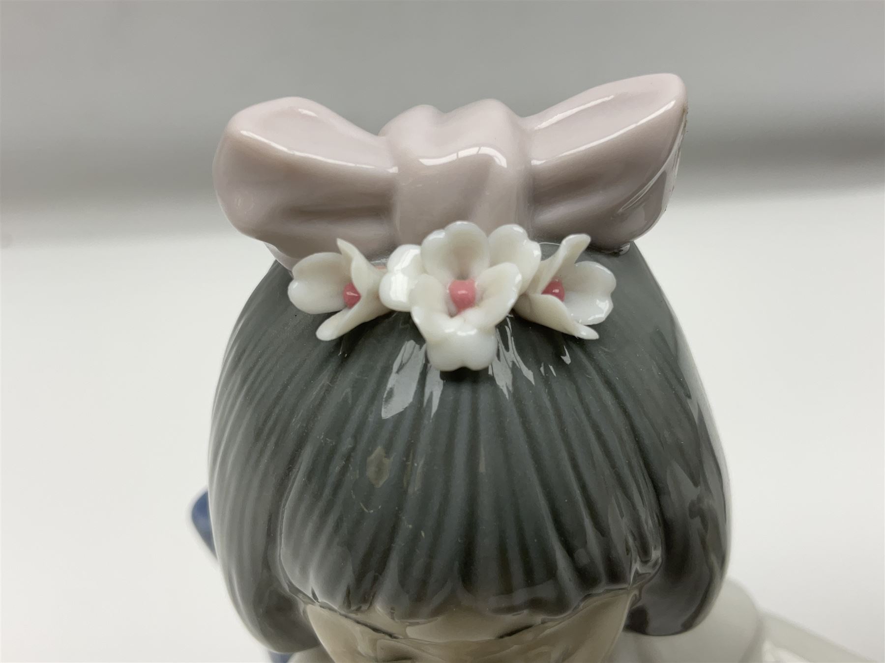 Six Lladro figures of the China doll set and Oriental doll set, comprising Playing the Flute no.6150, Bearing Flowers no.6151, Flower Gazer no. 6152, Oriental Dance no. 6230, Oriental Lantern no. 6231 and Oriental Beauty no. 6232, largest H20cm