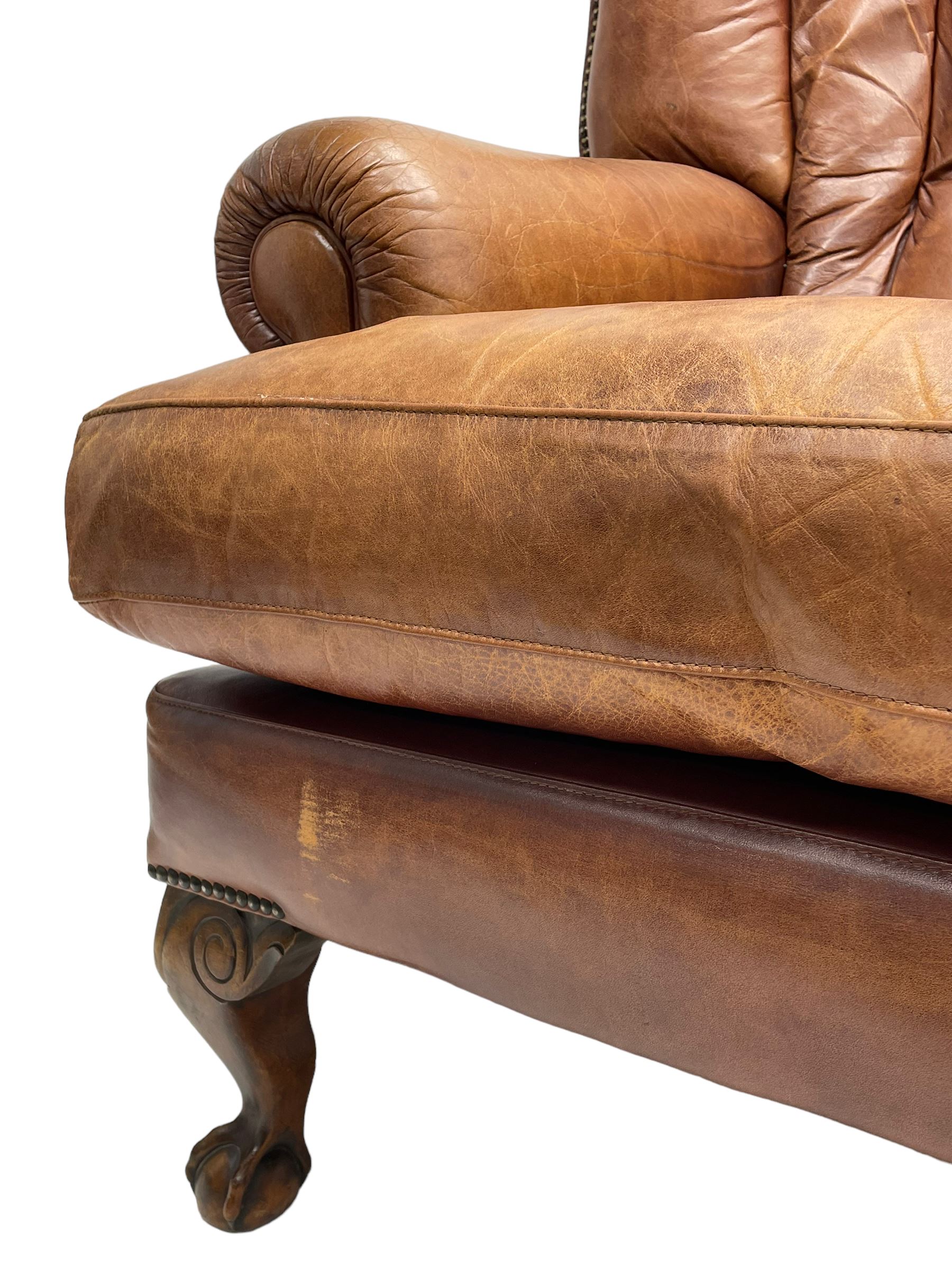 Tetrad - 'Blake' club armchair, fanned wingback and rolled arms upholstered in tan brown leather, on ball and claw carved cabriole feet 