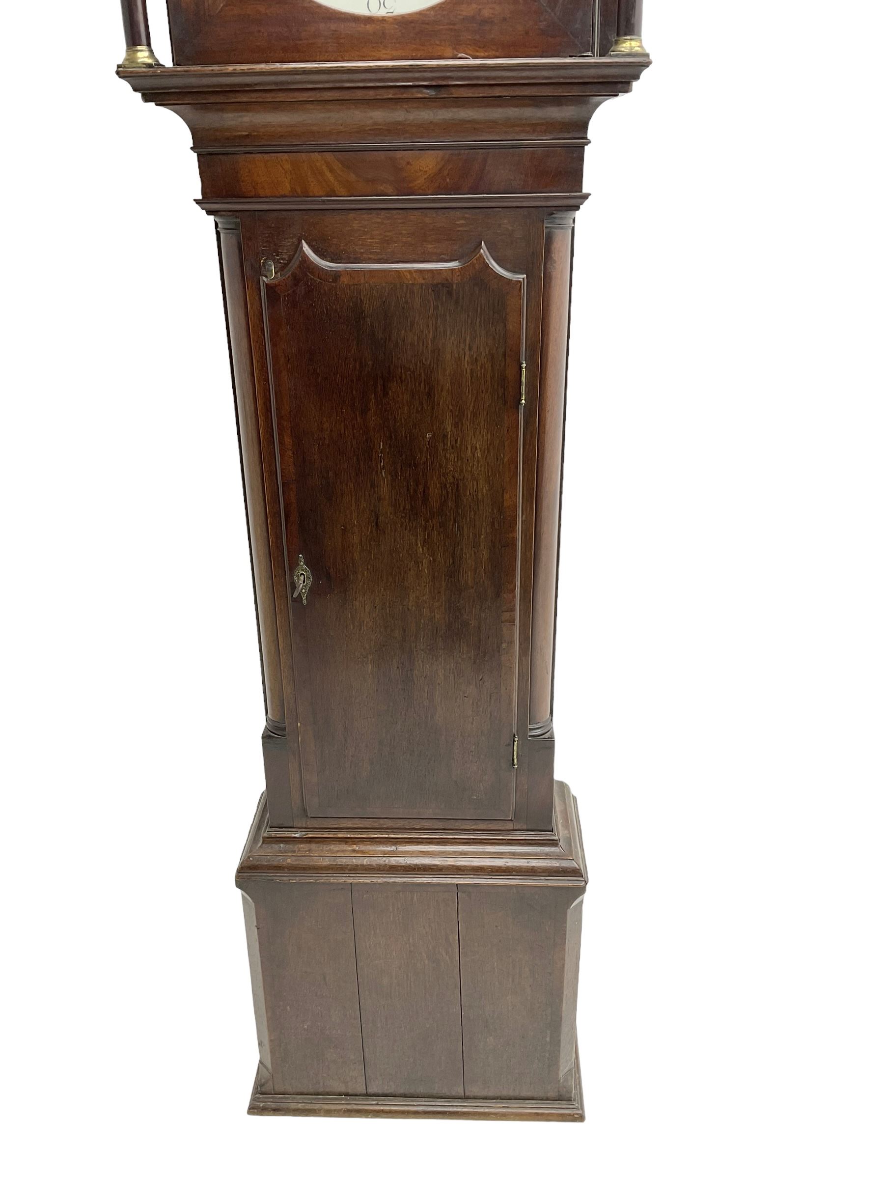 Henry Fisher of Preston (Lancs) -  late 18th century 30-hour oak and mahogany longcase clock c1790, with a flat topped pediment and moulded cornice, square hood door flanked by two plain pillars with brass capitals, trunk with recessed quarter columns, three-quarter length trunk door with an ogee twin spire top and crossbanding, rectangular plinth with canted corners and a narrow applied moulding to the base, circular 13” painted dial with Roman numerals, minute markers and five minute Arabic's, floral decoration to the centre and a semi-circular calendar aperture with date disc behind, original steel serpentine hands, dial inscribed “H Fisher, Preston”, dial pinned directly to a weight driven countwheel striking movement, striking the hours on a cast bell. With pendulum and weight.
Henry Fisher is recorded as working in Preston from 1742-95.
