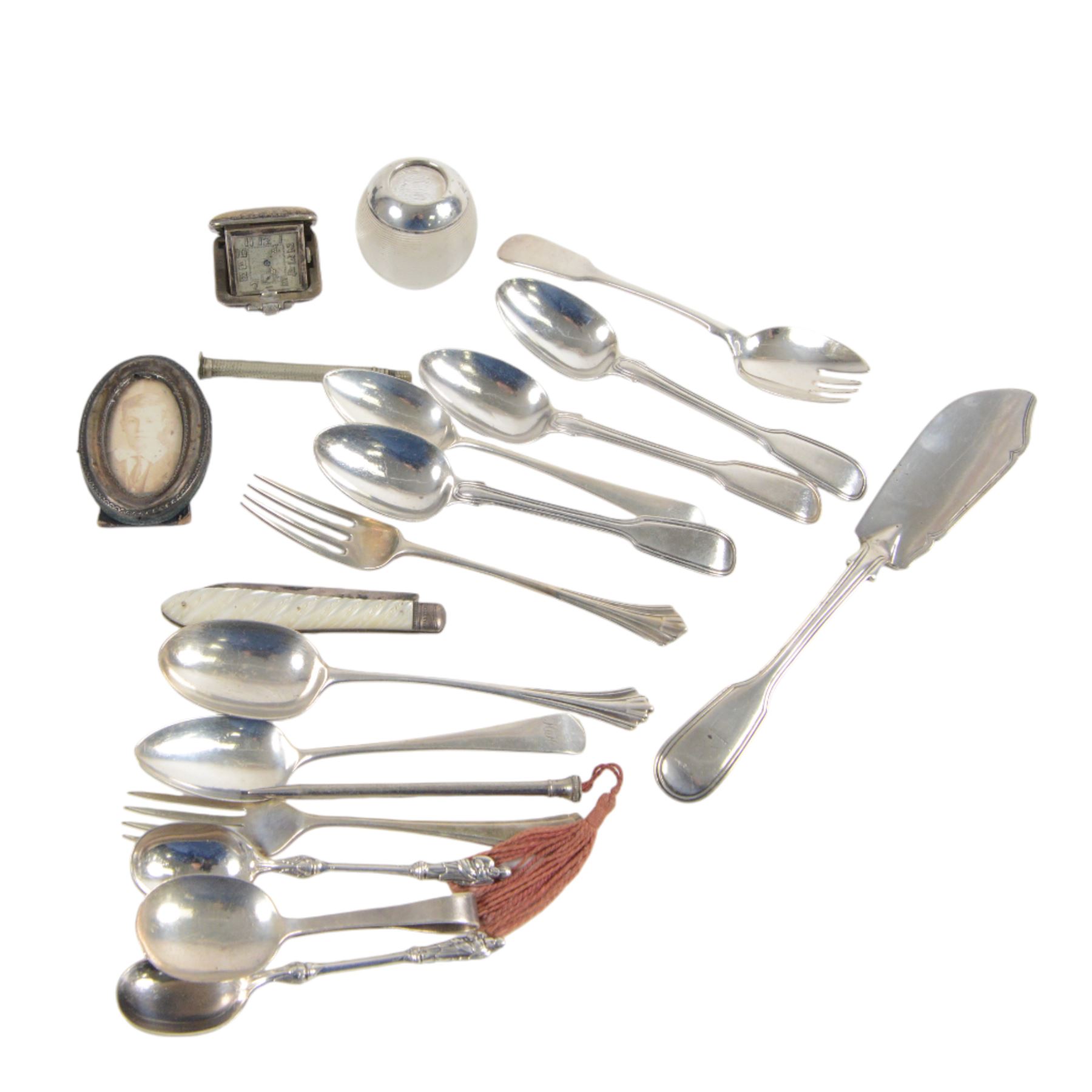 Collection of silver cutlery, including butter knife, apostle spoons, forks, etc, all hallmarked, together with Art Deco silver purse watch in green square shagreen case, silver mounted glass match striker, silver fruit knife with mother of pearl handle, silver mounted oval frame and a silver plated pencil