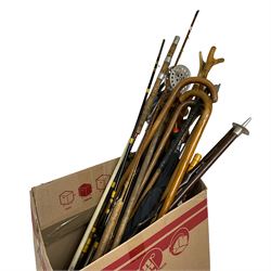 Large quantity of various walking sticks and canes, shooting sticks, fishing rods, umbrellas, etc including bamboo and shagreen style examples