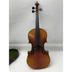 Czechoslovakian violin c1920 with 36cm two-piece maple back and ribs and spruce top, bears label 'Copy of Antonius Stradivarius Made in Czechoslovakia' L59cm; in carrying case; 1950s Czechoslovakian violin; and 195os Czechoslovakian three-quarter size violin; both cased (3)