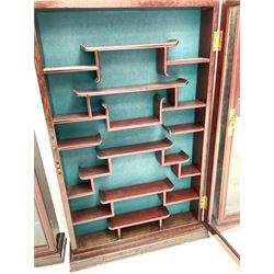 Three Chinese rosewood wall hanging cabinets, single glazed door enclosing shaped shelving