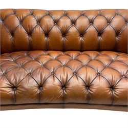 Tetrad - 'Oskar' grande three-seat sofa, Chesterfield shape with rolled arms, upholstered in buttoned tan leather, on turned and reed moulded feet 
