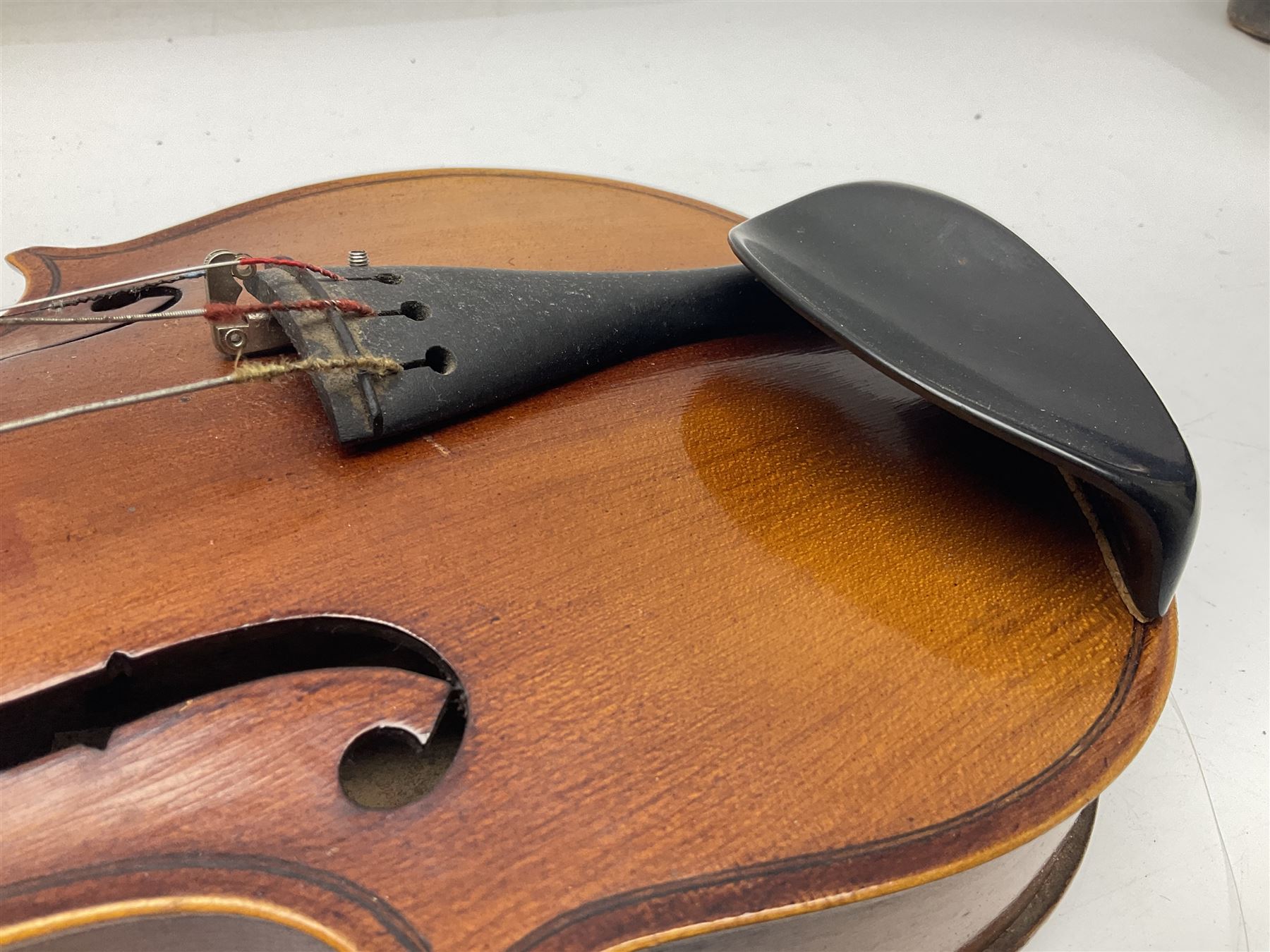 Saxony (?) violin c1950 with 36cm two-piece maple back and ribs and spruce top; bears label 'The Maidstone School Orchestra Association' L59cm overall; and 1950s Czechoslovakian violin for restoration; both in carrying cases (2)