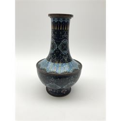 Japanese Cloisonné vase, the body of bulbus form with waisted neck,  upon spreading foot, with foliate decoration upon a black ground, H23cm. 