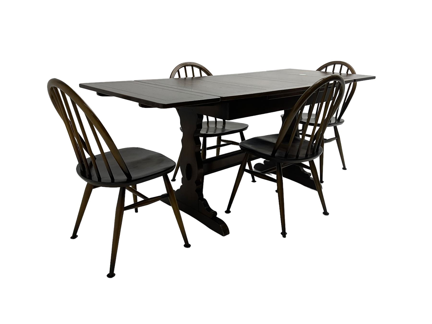 Ercol dark elm and beech extending dining table, and four stick back