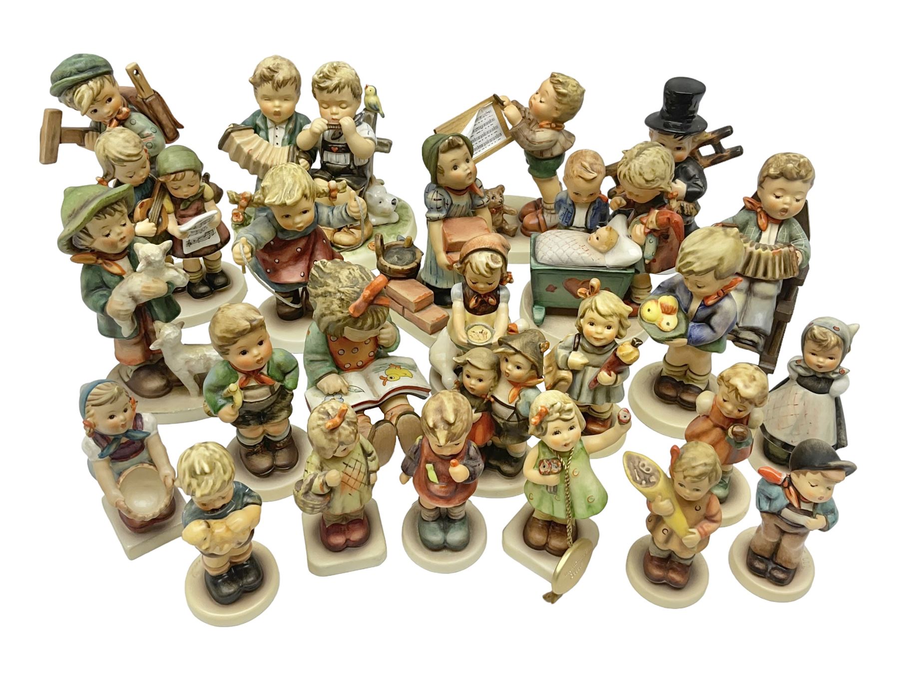 Twenty five Hummel figures by Goebel, to include Tuning up, Blessed Event, Book Worm, The Little Architect etc 