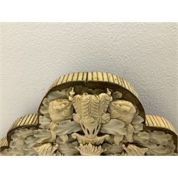 Pair 19th century French Dieppe bone and ivory wall mirrors, the oval bevelled mirror plates within rectangular frames with shaped tops, profusely decorated with ivory leaves, further detailed with carved bone armorial type crest inscribed 'SGOTORVM', putti, fish and mask heads, H81cm W48cm