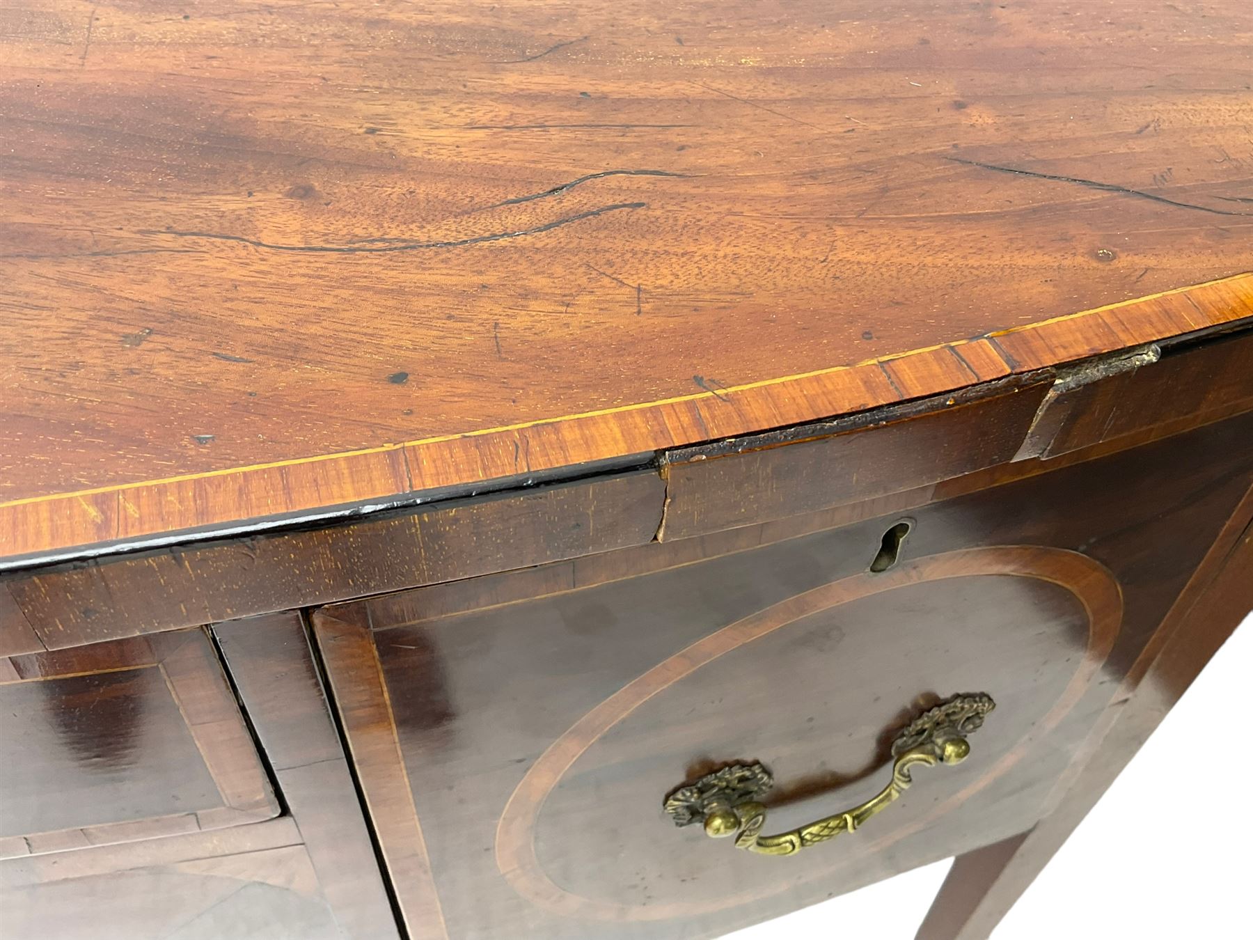 19th century inlaid mahogany bow-front sideboard, satinwood banded top over three drawers, on square tapering supports with spade feet