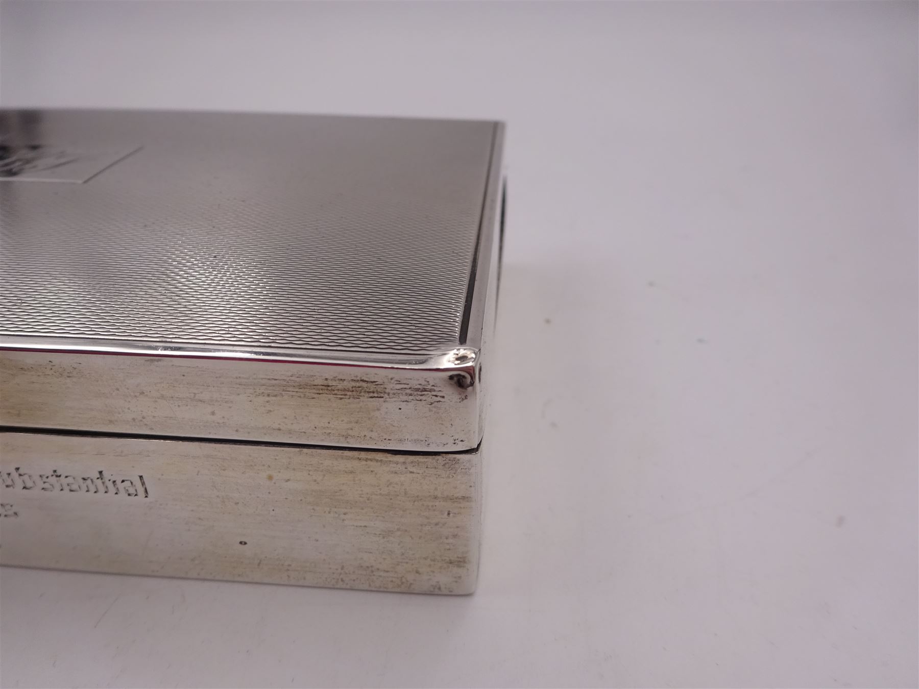 Modern silver mounted cigarette box, of rectangular form, with personal enraving to front and engine turned decoration and initials to cover, opening to reveal soft wood lined partitioned interior, hallmarked Frederick Field Ltd, Birmingham 1962