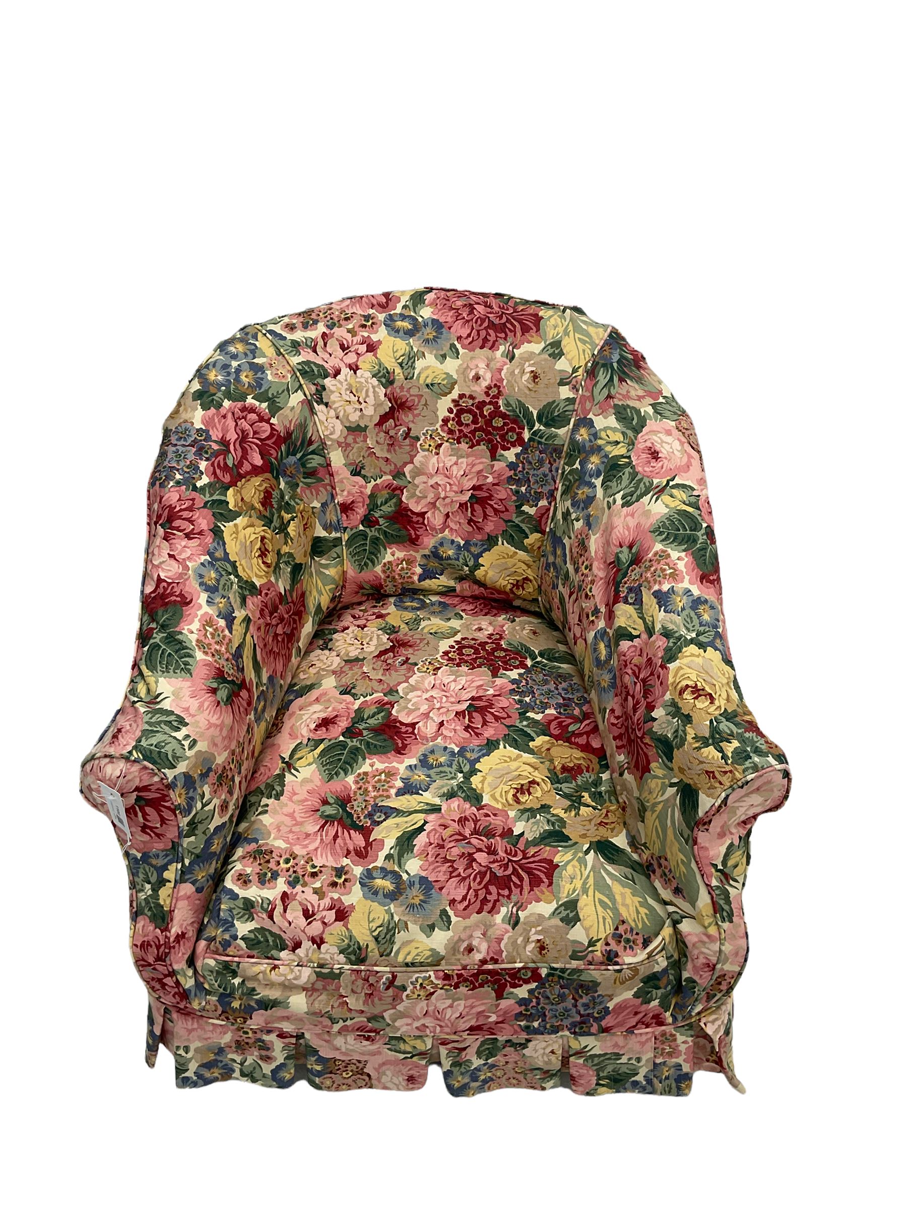 Victorian low tub shaped armchair, beech framed with compressed bun feet, loose floral fabric