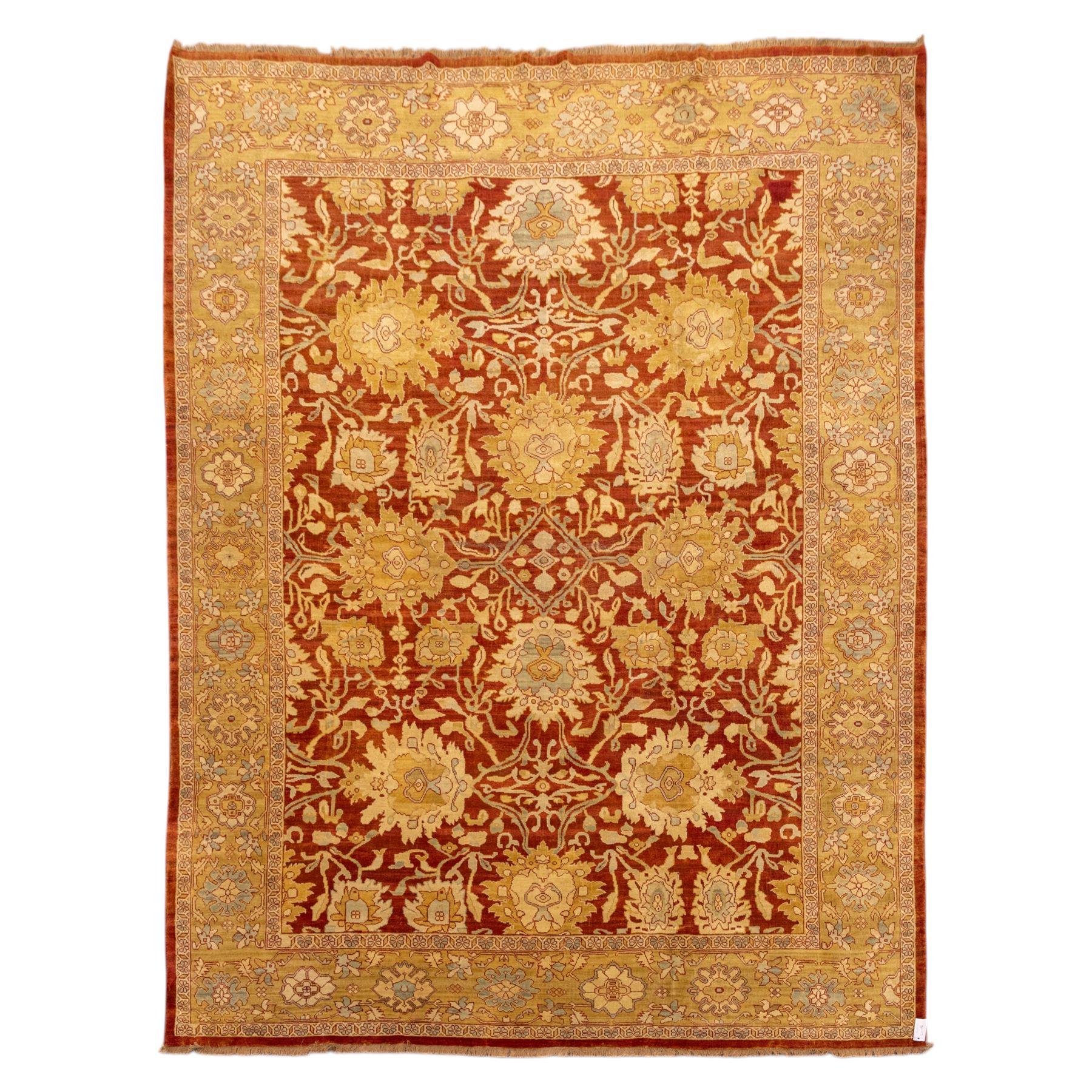 Central Persian Ziegler design hand-woven carpet, rich madder red field with central stylized lozenge medallion enclosed with an all-over lattice of scrolling vine, palmettes, and angular floral motifs of the Sultanbad tradition, broad ivory main border decorated with large-scale rosettes and flowering cartouches, flanked by narrow guard stripes, with fringe ends 