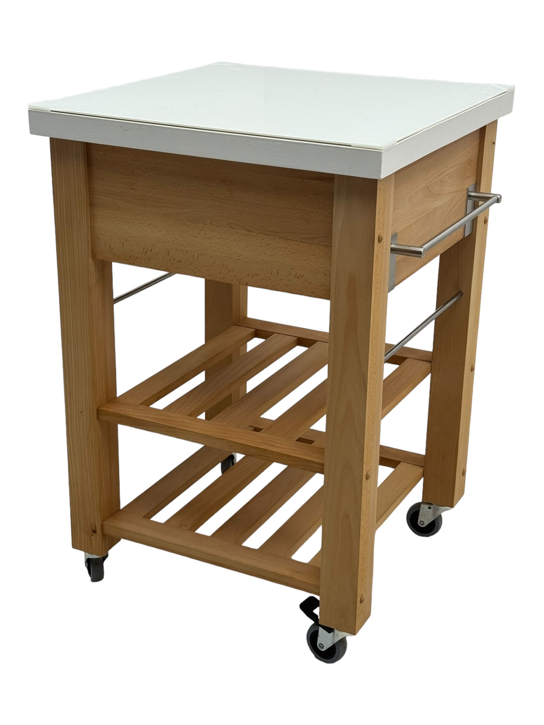 Contemporary butchers block kitchen trolley, white square top over beech frame, single pull-out drawer, dual slatted shelves, chrome towel rails, raised on square supports with castors