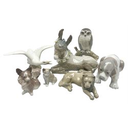 Lladro figures of animals, comprising Mini Lion no 5436, Beautiful Burro no 5683, Hawk Owl no 5422, Beagle Puppy Sitting no 1071, Duck Flying no 1264, Miniature Cat no 5308 and Small Papillon Dog no 4749, four with original boxes, largest example H14cm