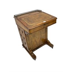 19th century walnut davenport, the top with gilt gallery over sloped hinged top, the interior fitted with small drawers, the right-hand side fitted with four drawers, on sledge feet with castors