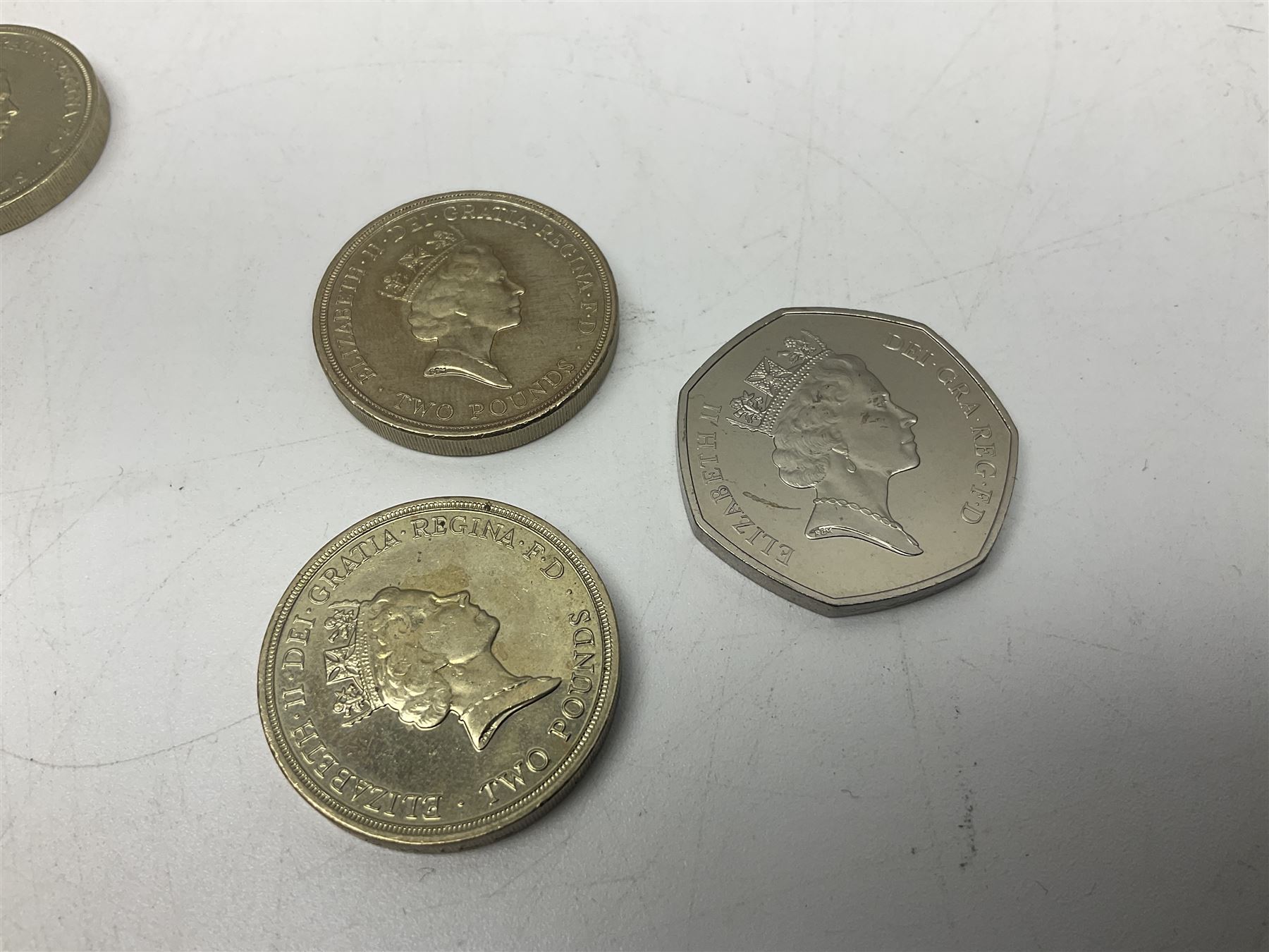 Queen Elizabeth II United Kingdom dual dated 1992/1993 fifty pence coin, five old style two pound coins including 1989 'Bill of Rights' etc and an Isle of Man 2002 two pound coin (7)