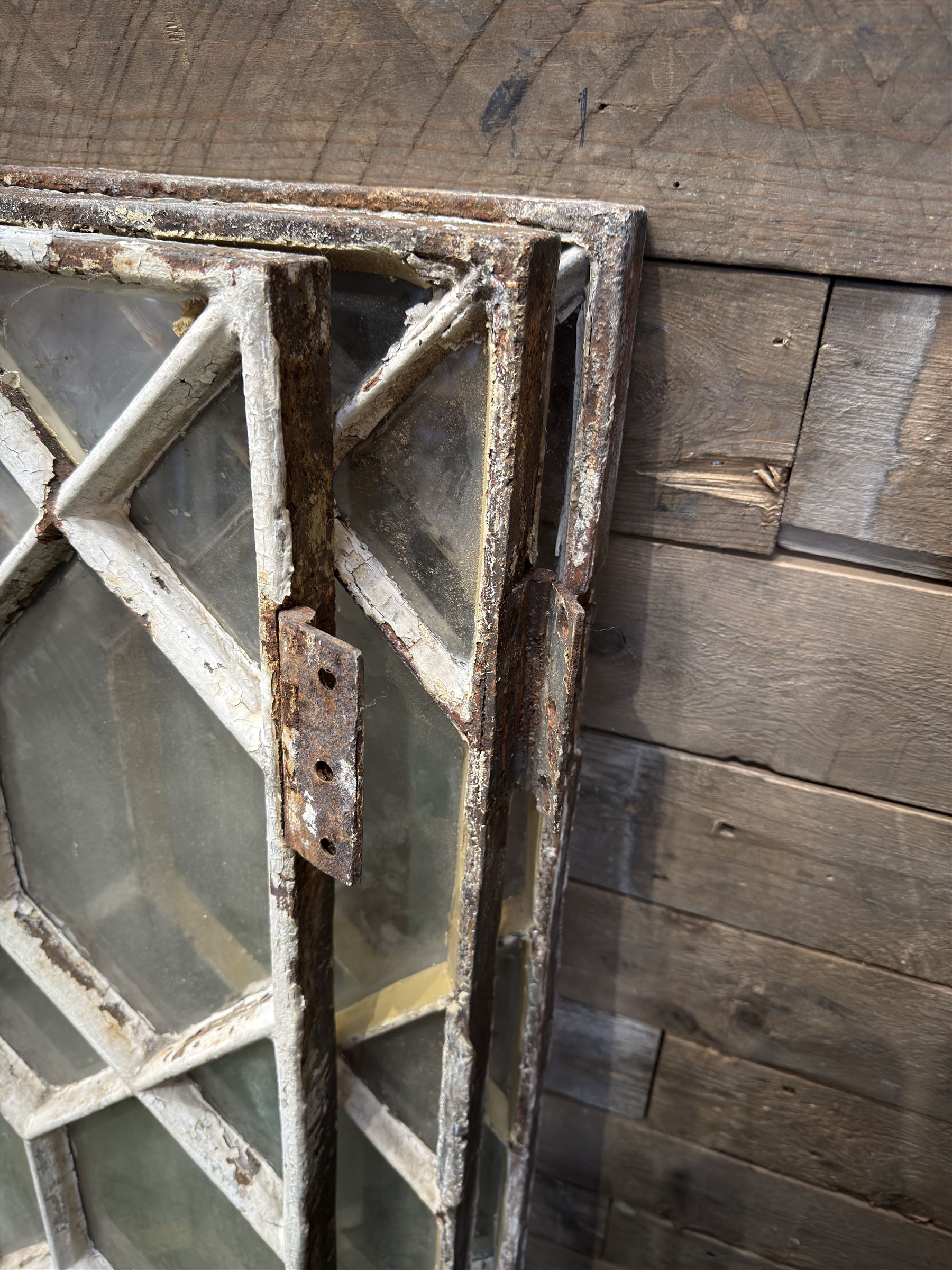 Four 19th century cast iron windows, lattice glazed in white painted finish, 