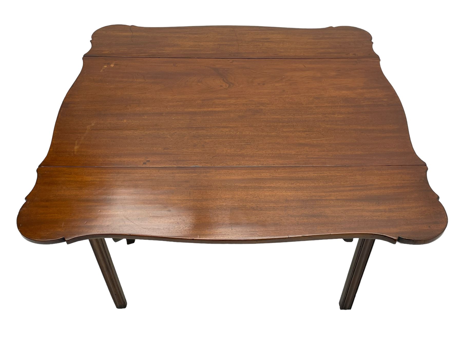 George III mahogany serpentine Pembroke table, the shaped drop-leaf top over single end drawer and shaped end rails, on square moulded supports