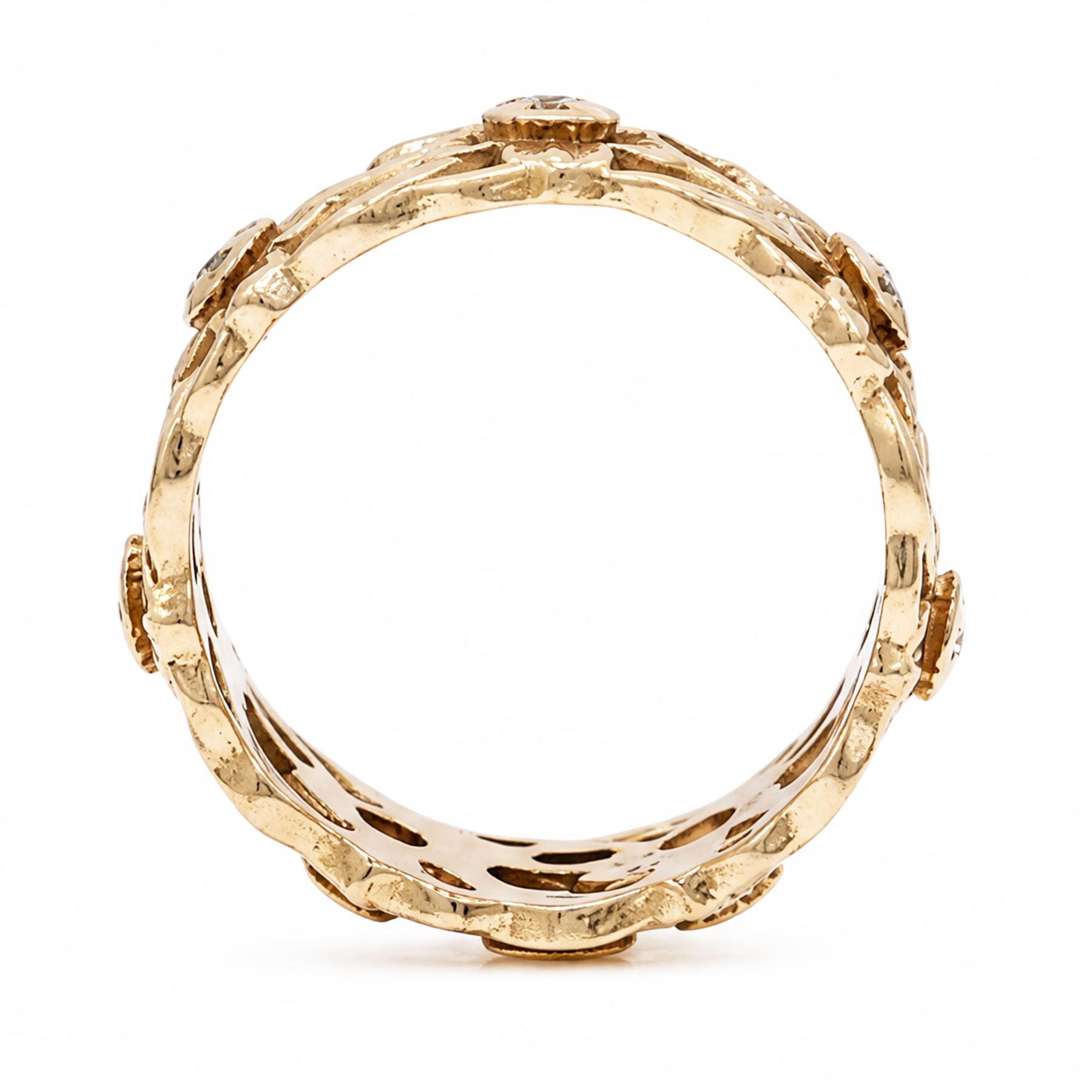14ct rose gold diamond set band, pierced floral band set with seven round brilliant cut diamonds, stamped 14k