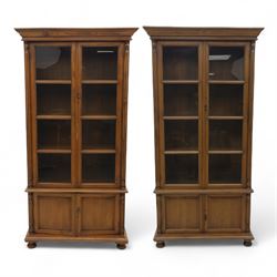 Pair of late 20th century Thai hardwood display cabinets, each with moulded cornice over t...